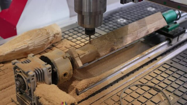 Wood carving machine. Modern automatic woodworking machine with CNC. Furniture production.