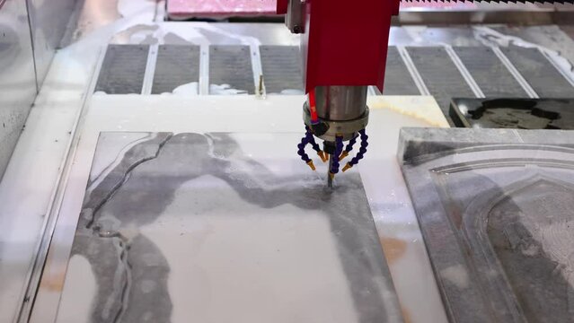 Laser automatic engraving of marble boards.