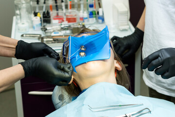 Isolate patient's teeth with rubber pad.