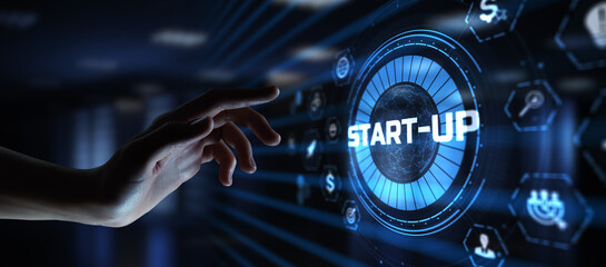 Startup new business development concept. Hand pressing button on screen.