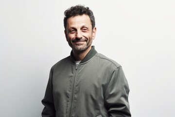 Obraz premium Portrait of a smiling man in a green hoodie on a white background