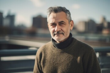 Naklejka premium Portrait of a handsome middle-aged man outdoors in the city