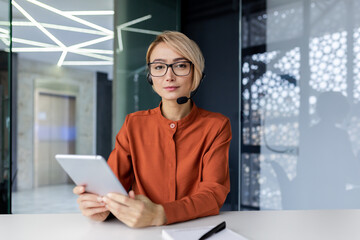 Portrait of confident female online customer support tech worker, businesswoman serious and...