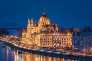 Budapest parliament illuminated at night.