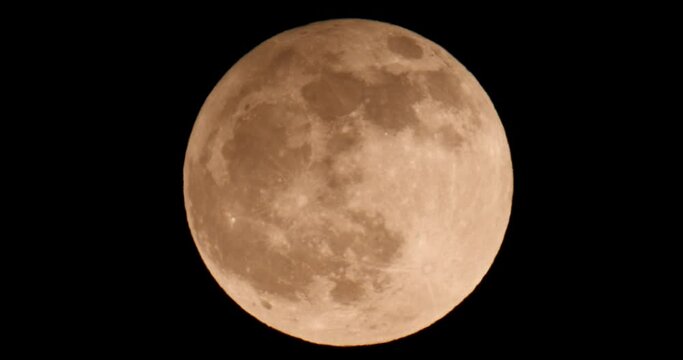Penumbral Lunar Eclipse May Flower Moon. Super Full Moon with Dark Background
