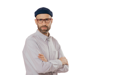 Male adult with thick brislte, keeps hands crossed, wears optical glasses, white formal shirt, stands sideways, models over pink background with free space for your promotional content or slogan