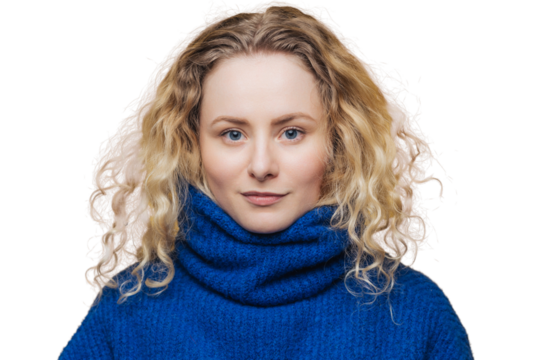 Indoor shot of good looking of serious blue eyed female wears blue warm sweater, looks confidently at camera, isolated over yellow background. Studio shot of beautiful curly woman models in studio