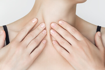 woman massaging her neck and clavicular mastoid muscle (Sternomastoid Muscle, Stemocleidomastoid Muscle). wellness self-massage at home concept
