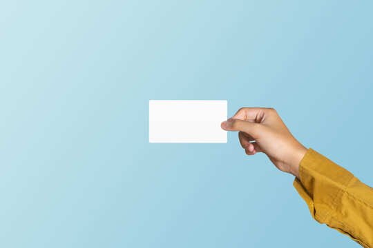 Hand holding blank white card on blue background include cutting path concept of business and finance