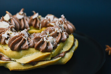 cake with coffee cream on the black background