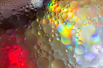 Colourful abstract background or graphic resource of bright oil drops on water. Wallpaper.