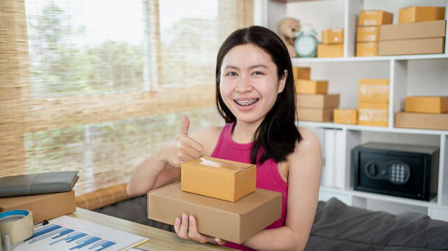 Small business owners or SMEs doing business related to selling and shipping online, New business style for young people working at home and owning businesses, Packing box, Sell online concept.