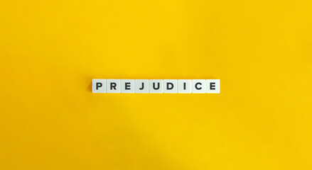 Prejudice Word on Letter Tiles on Yellow Background. Minimal Aesthetics.