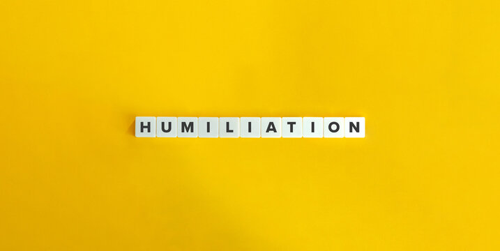Humiliation - abasement of pride. Word on Letter Tiles on Yellow Background. Minimal Aesthetics.