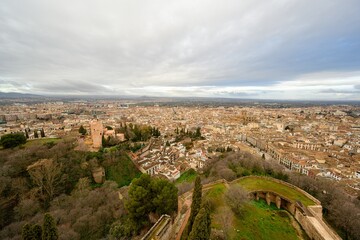 Fototapeta na wymiar The walls of the Alcazaba in the Alhambra and the panorama of Granada.