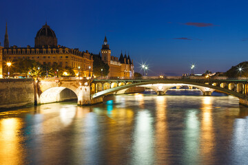 Fototapeta na wymiar Night view with Seine river and bridge in Paris, France, Europe