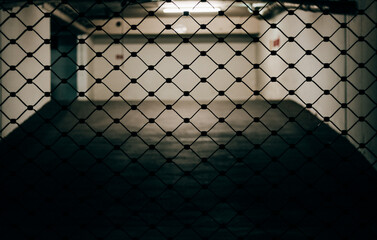 grid of a garage gate in the city at night