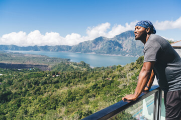 Cheerful African American man looking at mountains