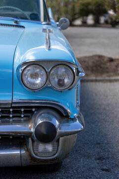 Sports car, light blue from America, old, historic with partially rusted chrome bumper © A.Freund