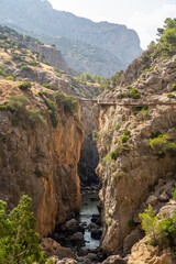 Views of the Caminito del Rey in Malaga, gorges, valleys, walkways, metal walkways, walking along a ferrata route during a sunny summer day