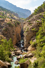 Views of the Caminito del Rey in Malaga, gorges, valleys, walkways, metal walkways, walking along a ferrata route during a sunny summer day