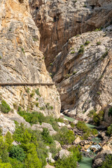 Fototapeta na wymiar Views of the Caminito del Rey in Malaga, gorges, valleys, walkways, metal walkways, walking along a ferrata route during a sunny summer day