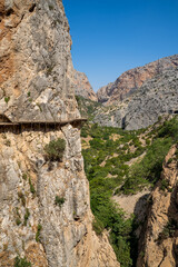 Views of the Caminito del Rey in Malaga, gorges, valleys, walkways, metal walkways, walking along a ferrata route during a sunny summer day