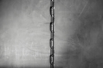 Fototapeta na wymiar Iron chain on the metal sheet background. Top view.