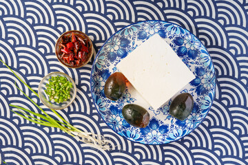 Preserved egg tofu on blue background