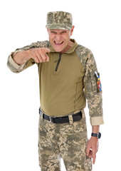 Portrait of very angry old defender pointing finger at camera and shouting out something, isolated on white background. Fifty years old soldier in camouflage posing in studio. Choice Concept.