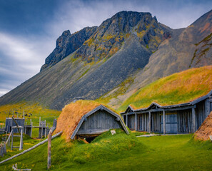 Beautiful summer view of old wooden ranch. Spectacular morning scene of Stokksnes headland,...