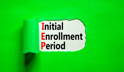 IEP symbol. Concept words IEP Initial enrollment period on beautiful white paper. Beautiful green table green background. Medical and IEP Initial enrollment period concept. Copy space.