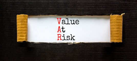 VAR Value at risk symbol. Concept words VAR Value at risk on beautiful white paper. Beautiful white...