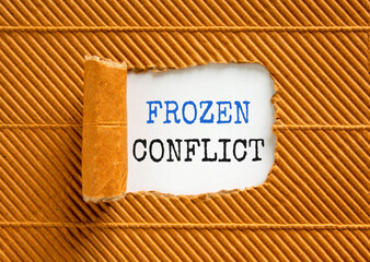 Frozen conflict symbol. Concept words Frozen conflict on beautiful white paper. Beautiful brown paper cardboard background. Business and Frozen conflict concept. Copy space.