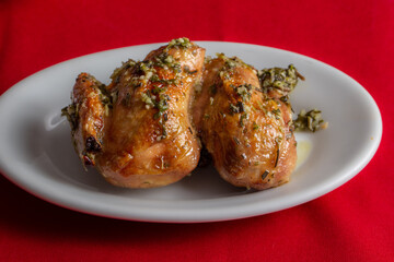 roasted chicken with herb sauce . In Brazil it is called a galeto.