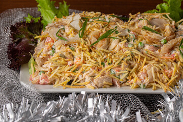 Codfish salad. Salpicão is a typical Brazilian salad, made with shredded cod, raisins, grated carrots, straw potatoes and mayonnaise..Served for Festive dinner