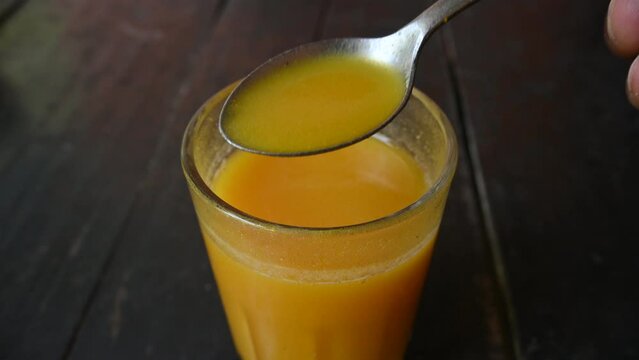 Bael fruit juice. Its other names Aegle marmelos, bael, bili, bhel, Bengal quince, golden apple, Japanese bitter orange, stone apple or wood apple. Healthy summer drink Bel ka Sharbat. Slow motion vid