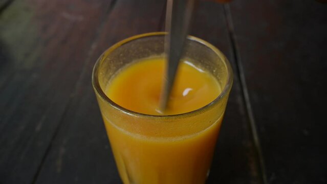 Bael fruit juice. Its other names Aegle marmelos, bael, bili, bhel, Bengal quince, golden apple, Japanese bitter orange, stone apple or wood apple. Healthy summer drink Bel ka Sharbat. Slow motion vid