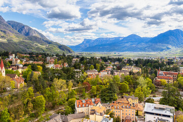 Fototapeta na wymiar View over cityscape of Merano, South tyrol, Italy seen from famous hiking trail Tappeinerweg