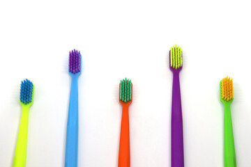 set of multicolored toothbrushes on white