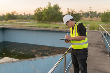 Environmental engineers work at wastewater treatment plants,Water supply engineering working at Water recycling plant for reuse
