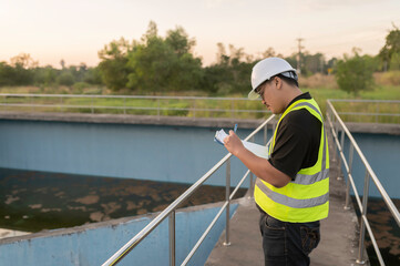 Environmental engineers work at wastewater treatment plants,Water supply engineering working at Water recycling plant for reuse