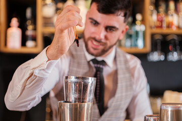 Mixologist preparing special drinks to surprise his customers. Concept: restaurant, consumption, drinks