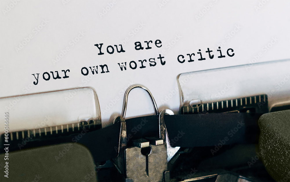 Poster text you are your own worst critic typed on retro typewriter