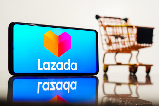 May 8, 2023, Brazil. In this photo illustration, the Lazada logo seen displayed on a smartphone along with a shopping cart.