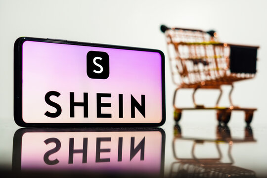 May 8, 2023, Brazil. In this photo illustration, the Shein logo seen displayed on a smartphone along with a shopping cart.