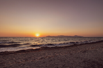 Obraz premium sunset at the beach in kos