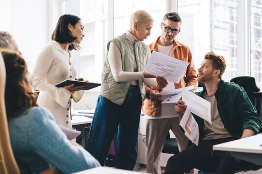 Group Of Successful Multiracial Male And Female People Discussing Partnership During Together Collaboration In Office Interior, Men And Women Talking About Business Marketing And Startup Projecting