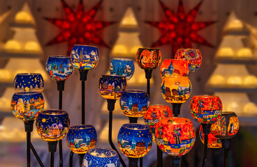 Blue, orange and yellow glass lamp with handmade art during Christmas season in Vienna, Austria