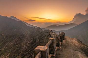 Dramatic sunset over the edge of Mount Bromo's crater, an active somma volcano, Bromo Tengger...